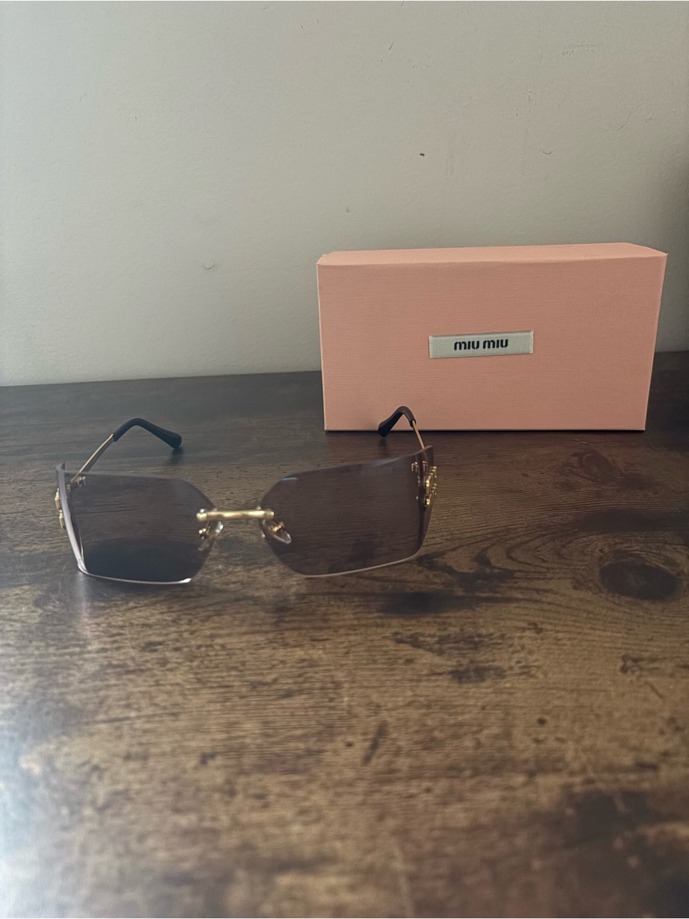 Miu Miu Women’s Rimless Sunglasses with Brown Gradient Lenses and Gold Accents
